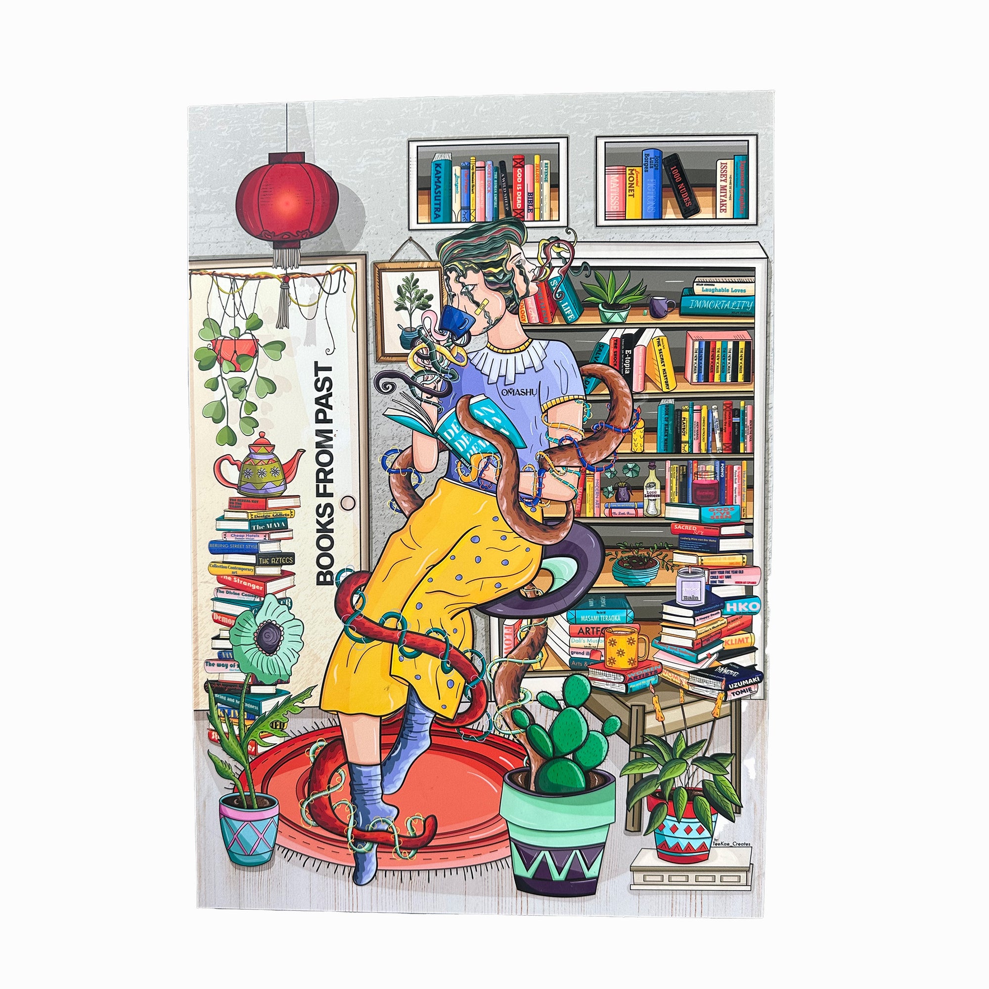 A poster of a girl sitting on a stack of multicolored books, reading a book with an orange cat on her lap. The girl is wearing a blue dress and has blonde hair. The cat is wearing a red collar with a bell. The background consists of a bookshelf, a red lamp, and a plant. The illustration is colorful and has a whimsical style. The text on the illustration reads ‘Books are my therapist’.