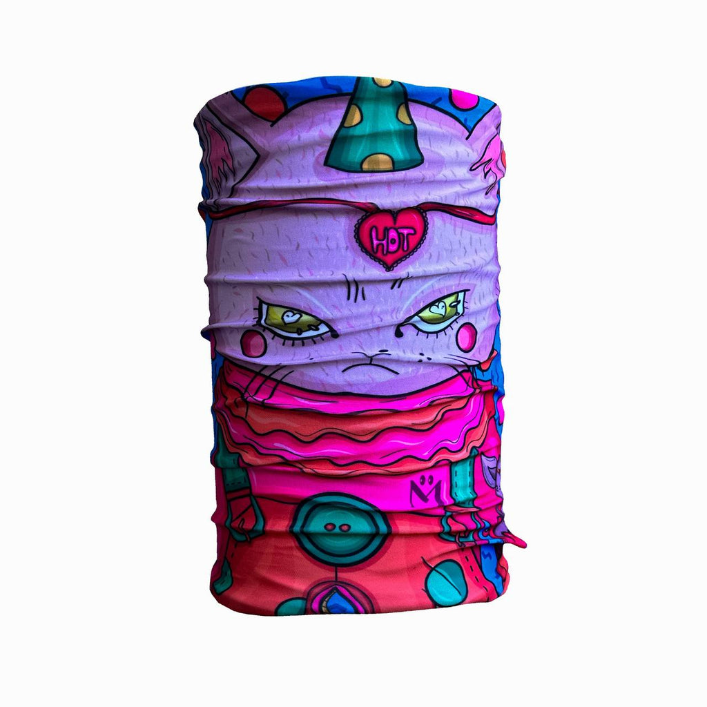 A colorful neck gaiter featuring an illustration of a grumpy-looking cartoon cat wearing a party hat. The design is vibrant with shades of pink, purple, and green, and the cat has intense green eyes, rosy cheeks, and a headband with the word "HOT" inside a heart. The lower part of the design includes buttons and abstract shapes in various colors.