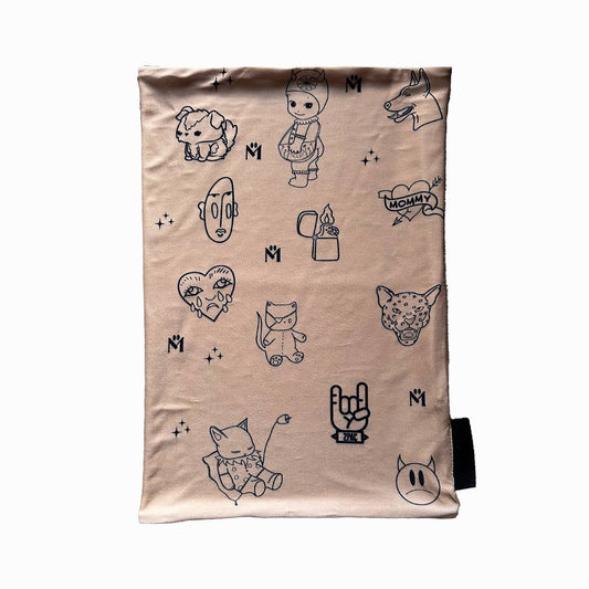 A rectangular beige fabric displaying a collection of black line-drawn illustrations, including a doll, animals, a lighter, a heart with the word "Mommy," and other whimsical characters. The illustrations are playful and arranged randomly across the fabric.