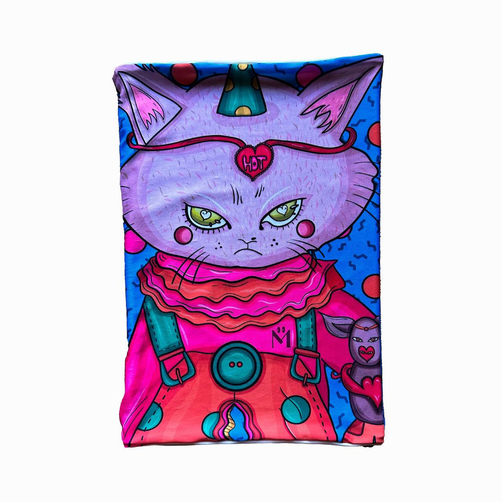 A rectangular colorful cloth displaying a full illustration of a cartoon cat wearing a party hat, headband with "HOT" inside a heart, and a detailed outfit with buttons and patterns. The design features vibrant colors including pink, purple, blue, and green, and a smaller character is standing next to the cat.
