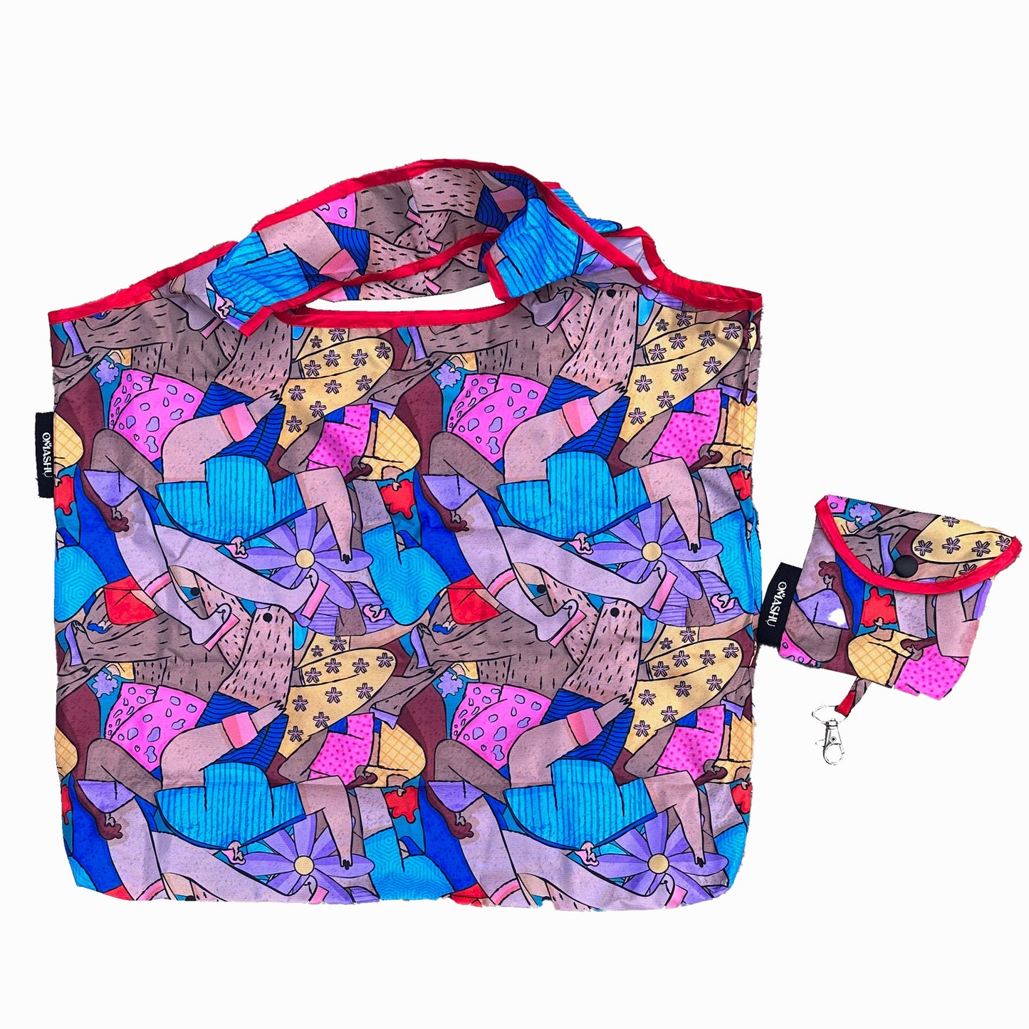 a stylish market bag adorned with a colorful pattern. The design includes abstract shapes in shades of pink, blue, and yellow, reminiscent of flowers and playful elements. The bag comes with a coordinating smaller pouch.