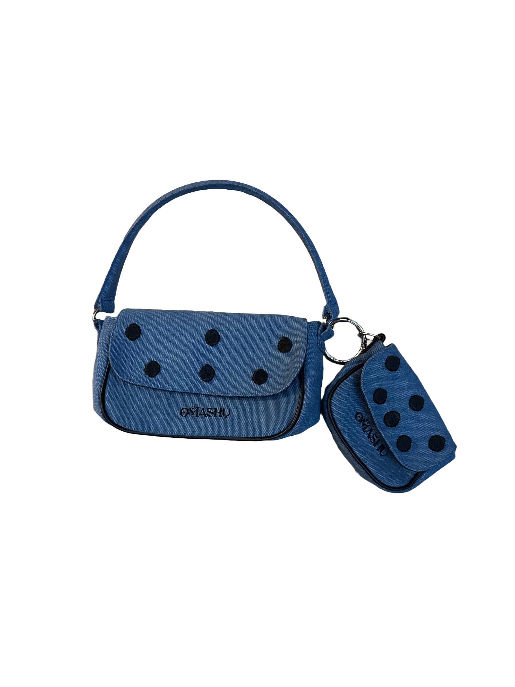 Omashu Nina Loop Dot Bag in blue cotton, showing the main shoulder bag and detachable smaller pouch, both featuring black dot embellishments and OMASHU logo, connected by a silver O-ring.