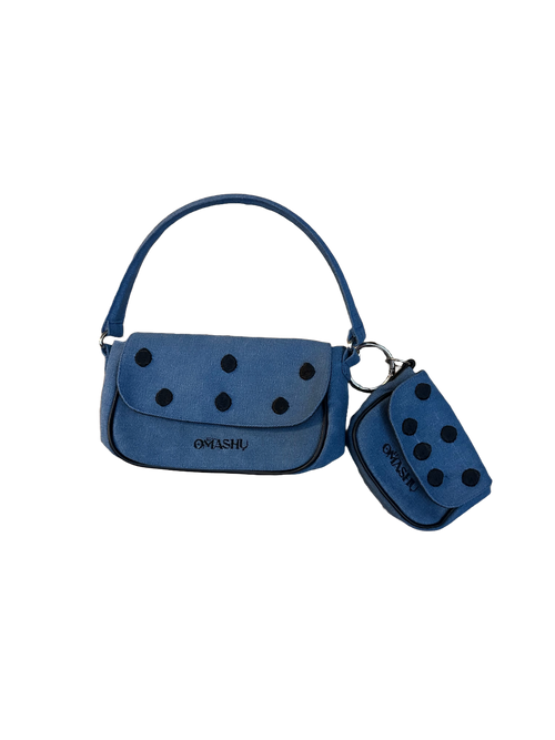 Omashu Nina Loop Dot Bag in blue cotton, showing the main shoulder bag and detachable smaller pouch, both featuring black dot embellishments and OMASHU logo, connected by a silver O-ring.