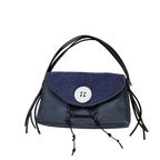 Blue handbag with black straps on a white background
