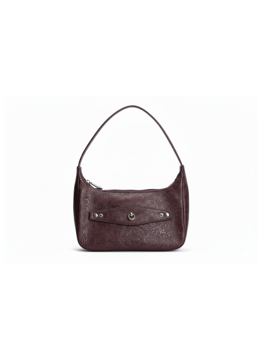 Burgundy faux leather handbag on a white background