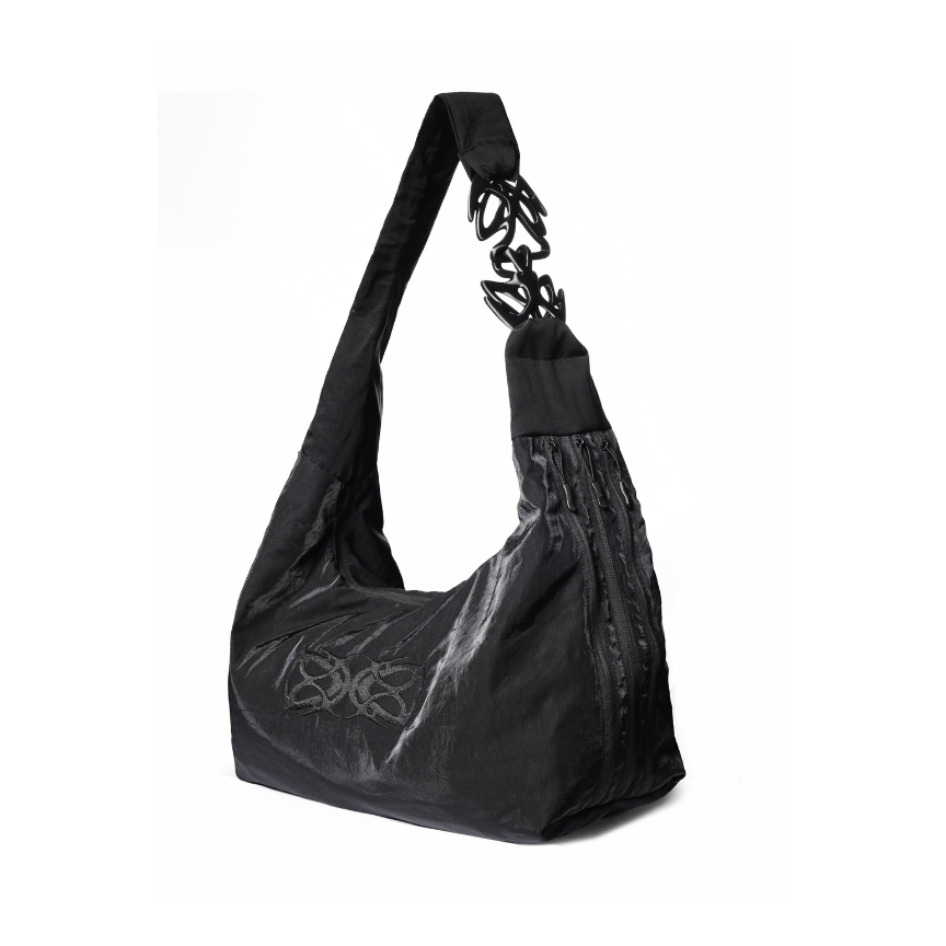 Black handbag with chain detail on a white background