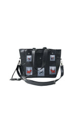 Omashu black tote bag with embroidered patches, laptop divider, and adjustable strap, showcasing bold streetwear accessory.