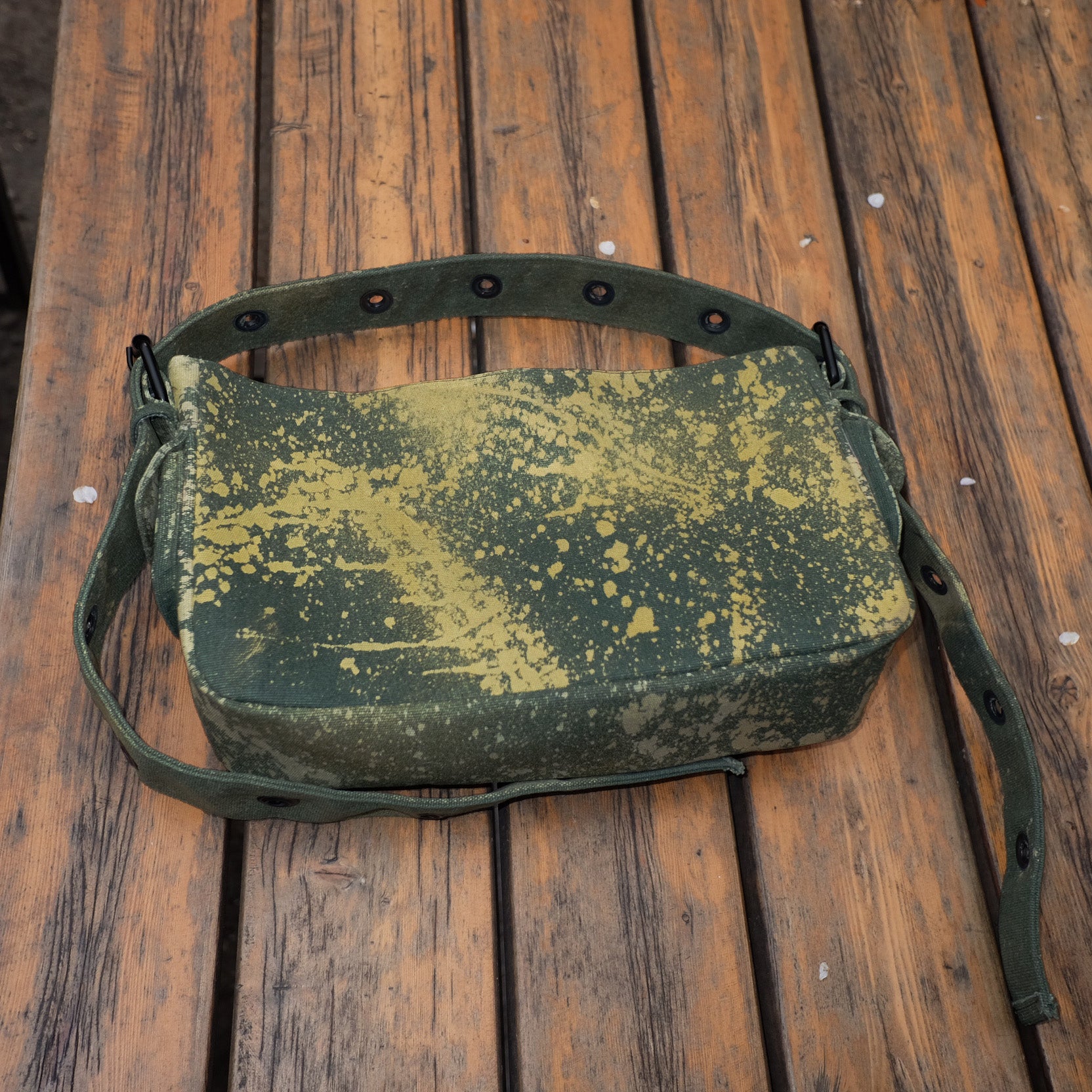 green back with tie dye patterns on wooden background
