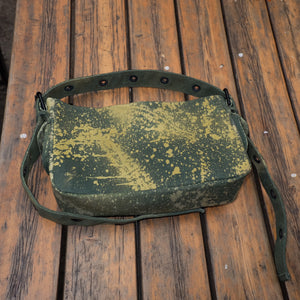 green back with tie dye patterns on wooden background