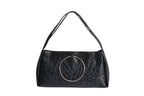 Black bag features a circular and wavy metallic embellishment on the front. Made from faux leather material.