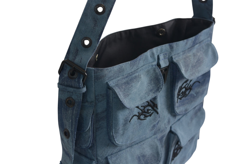 Keychain Cargo Bag XL - Ocean with tribal embroidery and multiple pockets, displayed on a plain background.