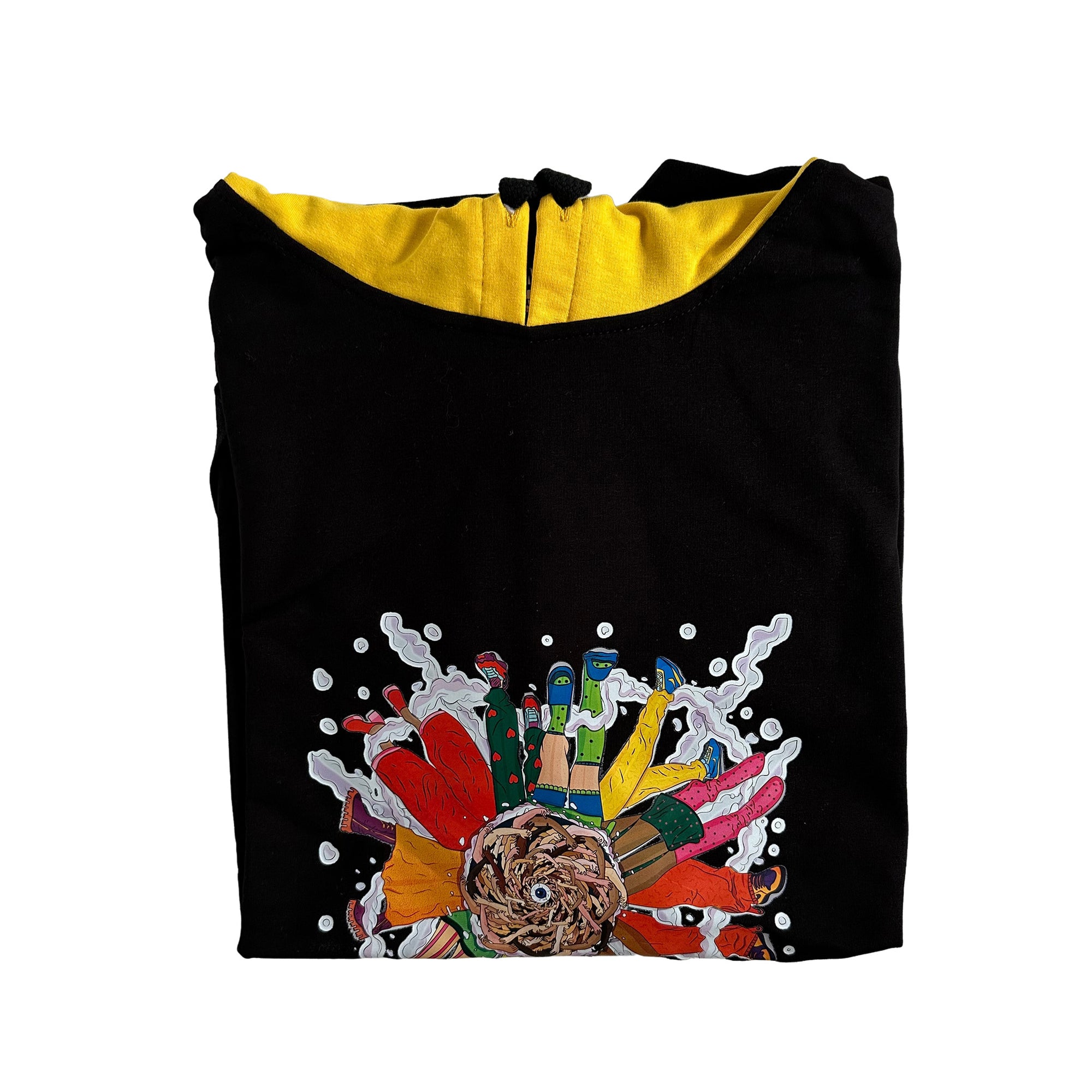 A black hoodie with a colorful graphic design on the front. The graphic design is a collage of different elements such as a lion’s head, flowers, paint splatters, and bottles. The hoodie has a yellow inner lining and a drawstring hood. The image is a close-up of the folded hoodie, so only the front part of the hoodie is visible.